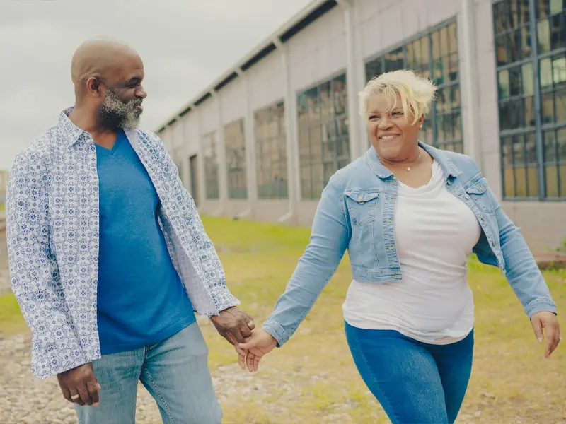 Jason and Ros Hamilton walking outside